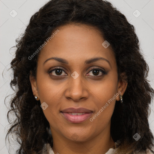 Joyful black young-adult female with long  brown hair and brown eyes