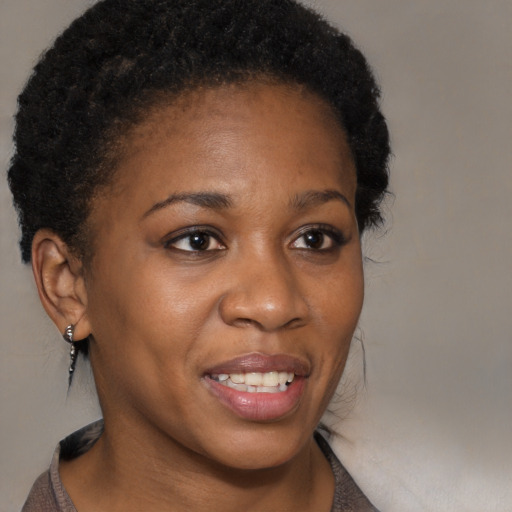 Joyful black young-adult female with medium  brown hair and brown eyes