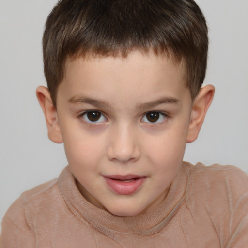 Joyful white child male with short  brown hair and brown eyes