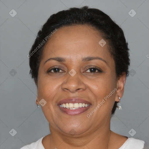 Joyful black adult female with short  brown hair and brown eyes