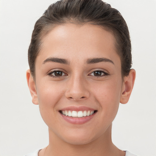 Joyful white young-adult female with short  brown hair and brown eyes