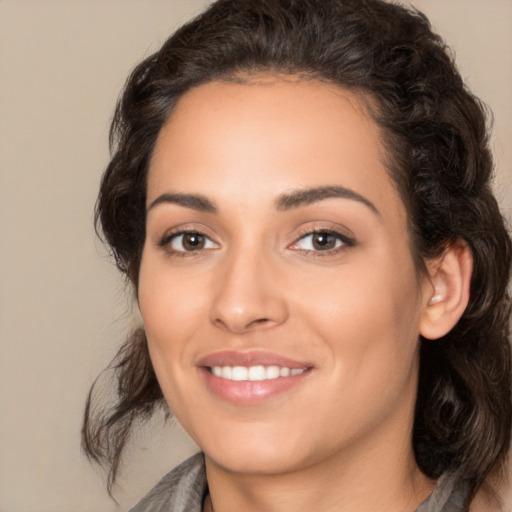 Joyful white young-adult female with medium  brown hair and brown eyes