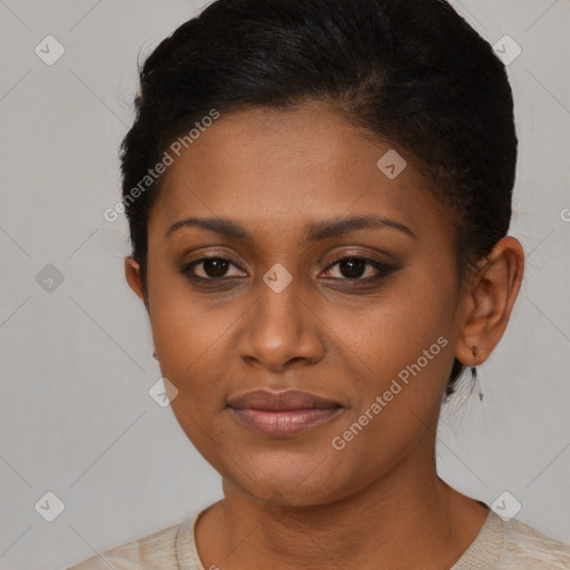 Joyful black young-adult female with short  brown hair and brown eyes