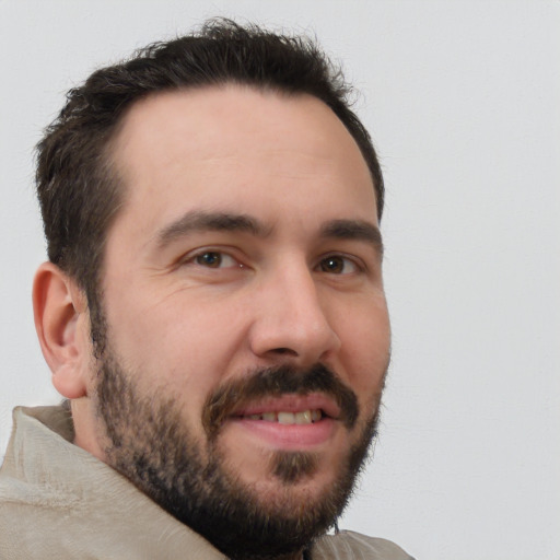 Joyful white young-adult male with short  brown hair and brown eyes