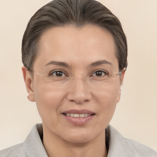 Joyful white adult female with short  brown hair and brown eyes