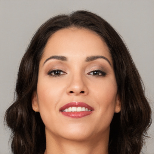 Joyful white young-adult female with long  brown hair and brown eyes