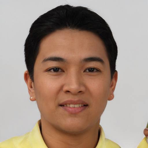 Joyful asian young-adult male with short  black hair and brown eyes