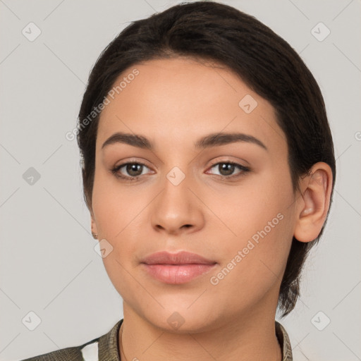 Joyful white young-adult female with short  black hair and brown eyes