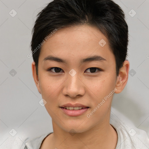 Joyful asian young-adult female with short  brown hair and brown eyes