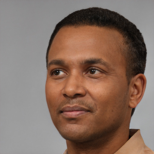 Neutral black young-adult male with short  black hair and brown eyes