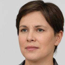 Joyful white adult female with short  brown hair and brown eyes