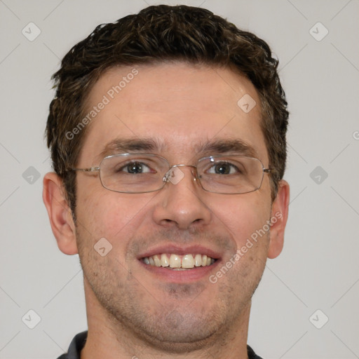 Joyful white adult male with short  brown hair and brown eyes