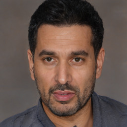 Neutral white adult male with short  black hair and brown eyes