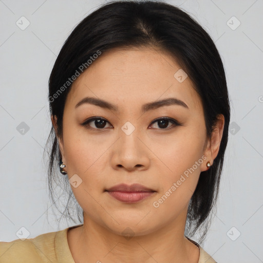 Joyful asian young-adult female with medium  black hair and brown eyes