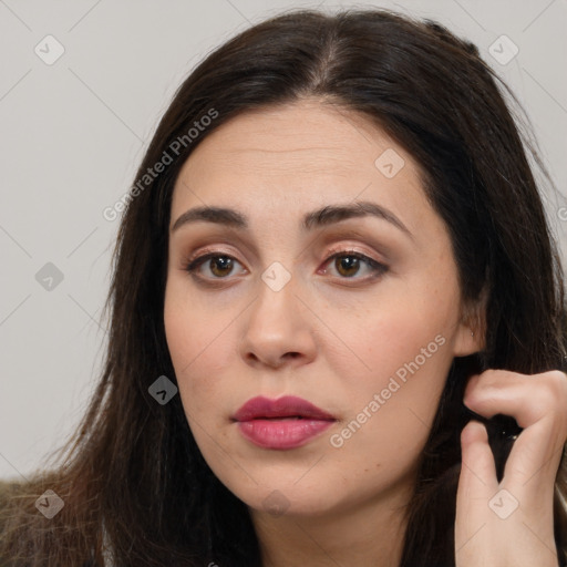 Neutral white young-adult female with long  brown hair and brown eyes