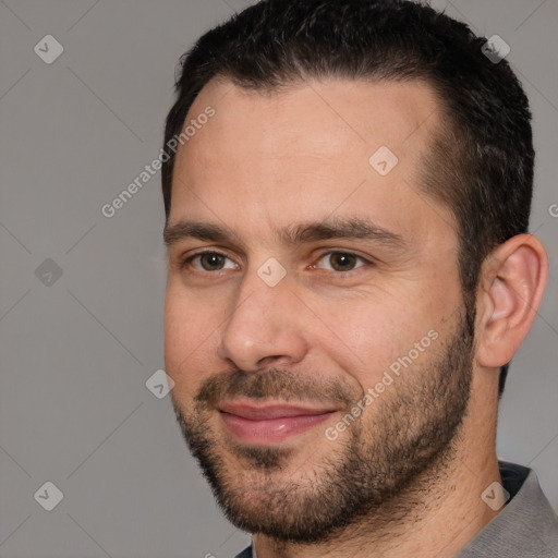 Joyful white adult male with short  brown hair and brown eyes