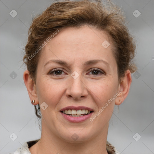 Joyful white adult female with short  brown hair and grey eyes