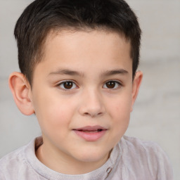 Joyful white child male with short  brown hair and brown eyes