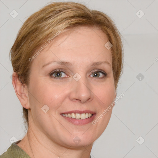 Joyful white adult female with medium  brown hair and blue eyes