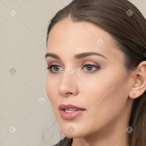 Neutral white young-adult female with long  brown hair and brown eyes