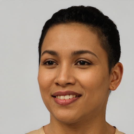 Joyful latino young-adult female with short  black hair and brown eyes