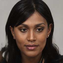 Joyful asian young-adult female with long  black hair and brown eyes