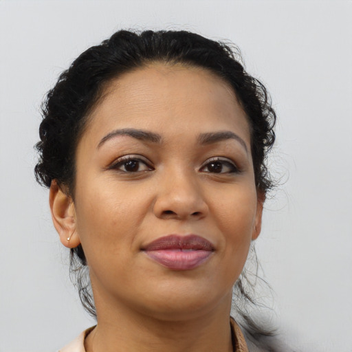 Joyful black young-adult female with medium  brown hair and brown eyes