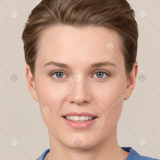 Joyful white young-adult female with short  brown hair and grey eyes