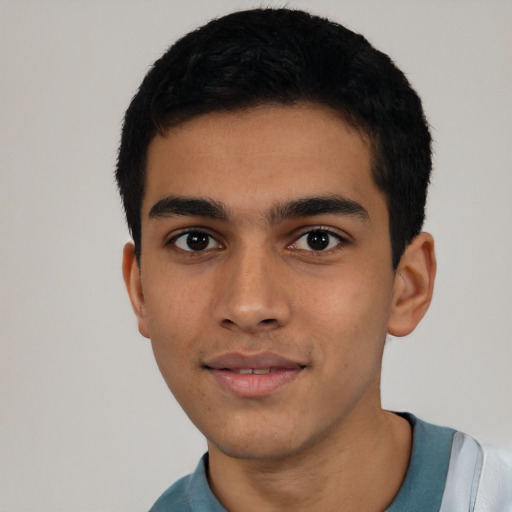 Joyful latino young-adult male with short  black hair and brown eyes