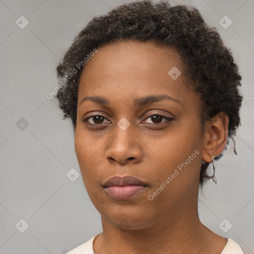 Neutral black young-adult female with short  brown hair and brown eyes