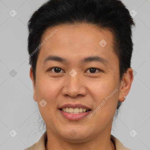 Joyful latino young-adult male with short  brown hair and brown eyes