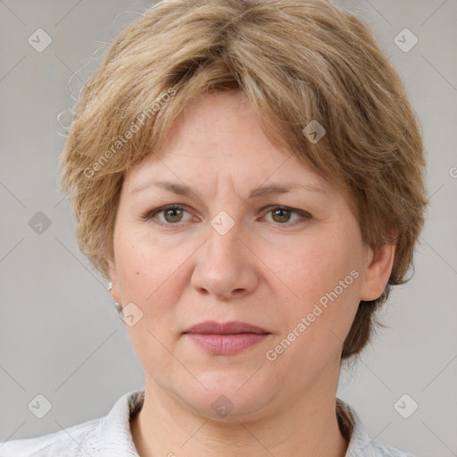 Joyful white adult female with medium  brown hair and grey eyes