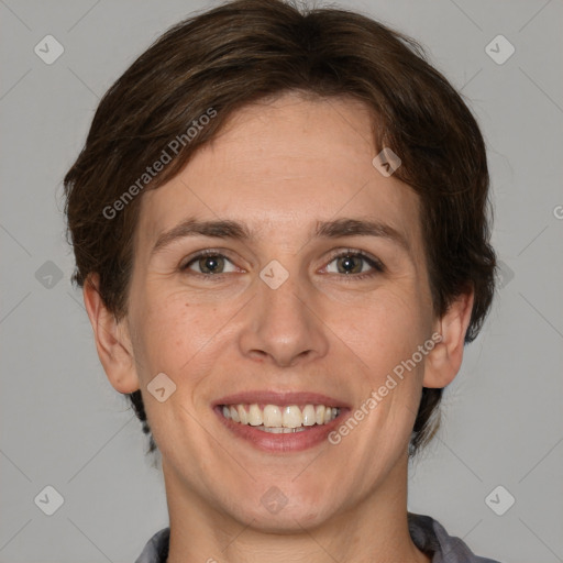 Joyful white adult female with short  brown hair and brown eyes