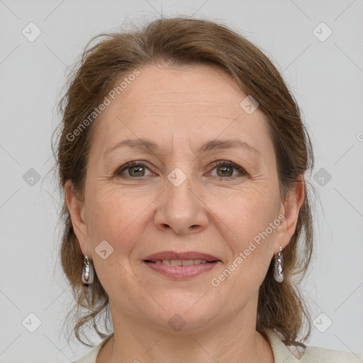 Joyful white adult female with medium  brown hair and grey eyes