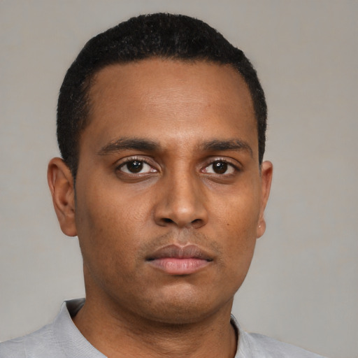 Neutral latino young-adult male with short  black hair and brown eyes