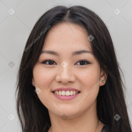 Joyful asian young-adult female with long  brown hair and brown eyes