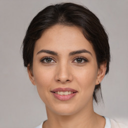 Joyful white young-adult female with medium  brown hair and brown eyes