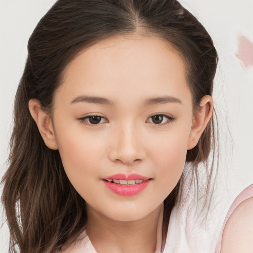 Joyful white child female with long  brown hair and brown eyes