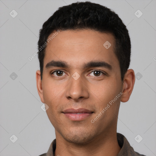 Joyful white young-adult male with short  black hair and brown eyes