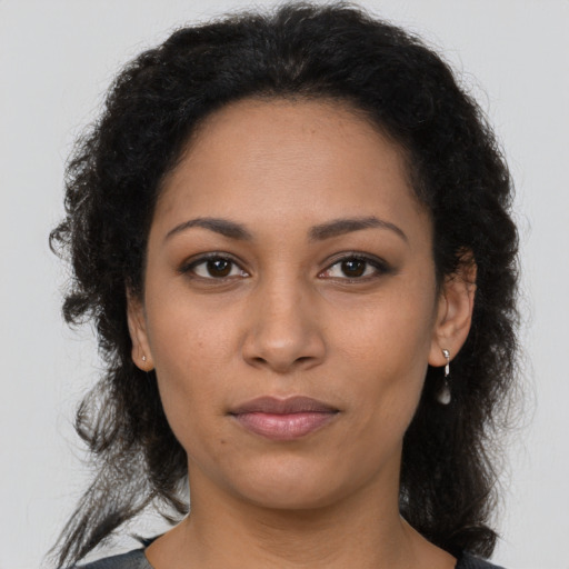 Neutral latino young-adult female with long  brown hair and brown eyes