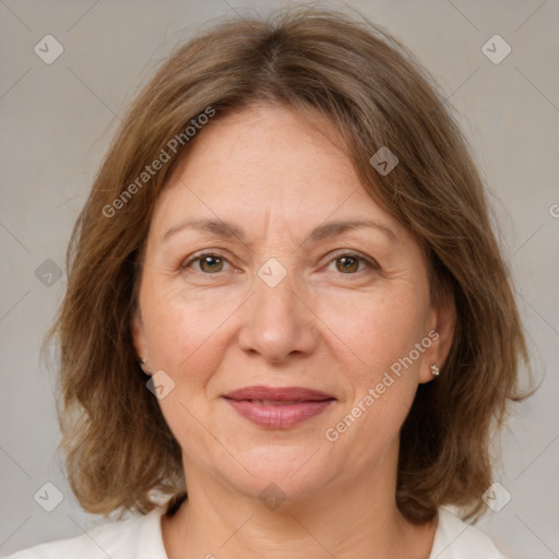 Joyful white adult female with medium  brown hair and brown eyes