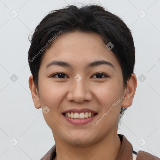 Joyful asian young-adult female with short  brown hair and brown eyes