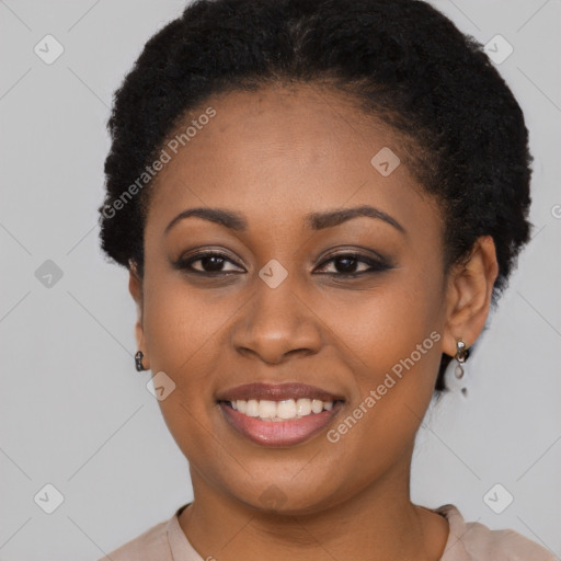 Joyful black young-adult female with short  black hair and brown eyes