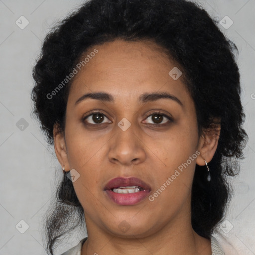 Joyful latino young-adult female with medium  black hair and brown eyes