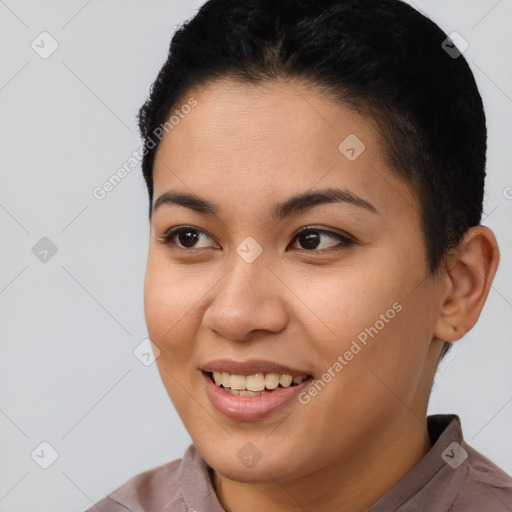 Joyful latino young-adult female with short  brown hair and brown eyes