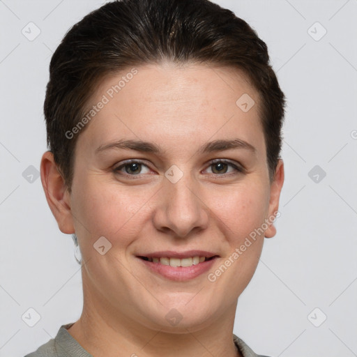 Joyful white young-adult female with short  brown hair and grey eyes