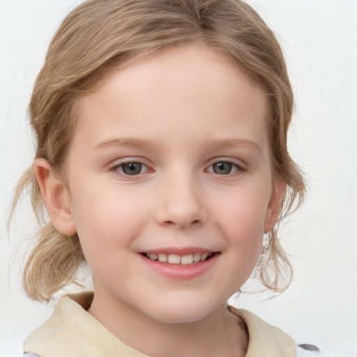 Joyful white child female with medium  brown hair and grey eyes