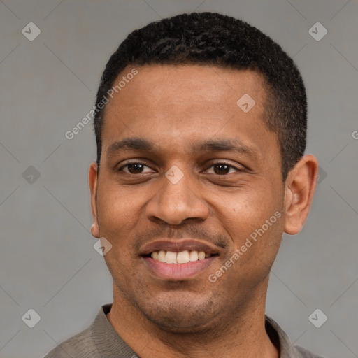 Joyful latino young-adult male with short  black hair and brown eyes