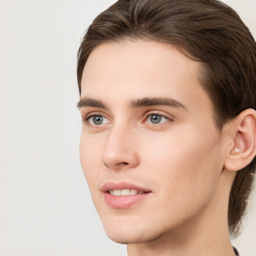 Joyful white young-adult male with medium  brown hair and brown eyes