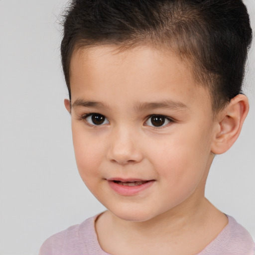 Joyful white child male with short  brown hair and brown eyes